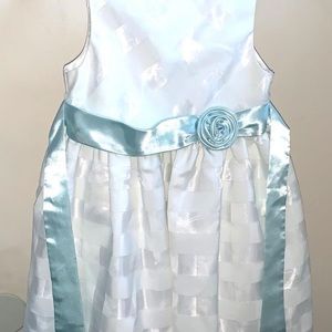 Fairly new, half white with baby blue ribbons